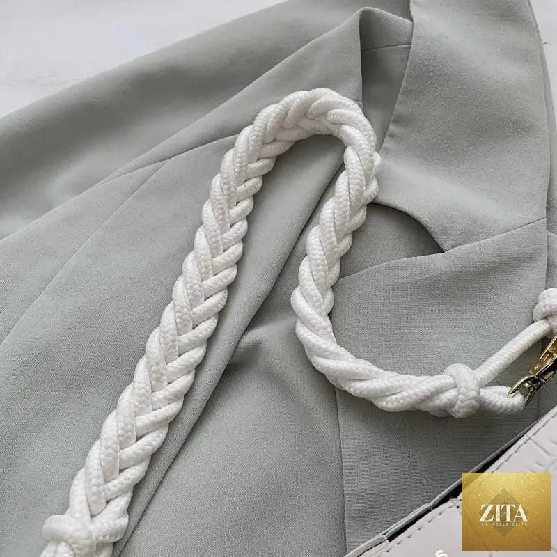 Elegant vintage-style women's bucket bag with stone pattern and genuine leather, featuring a shoulder strap for ladies.