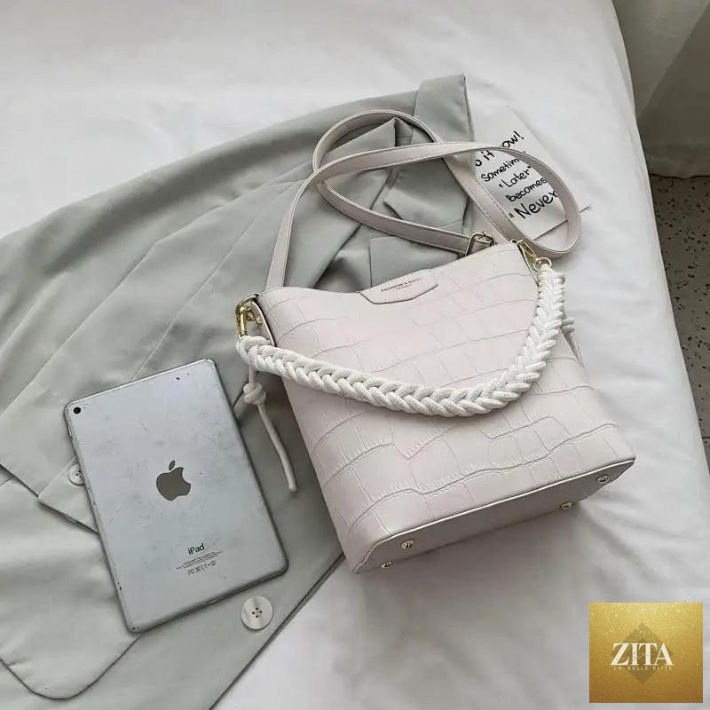 Elegant vintage-style women's bucket bag by Stevvex featuring genuine leather and a stone pattern shoulder design.