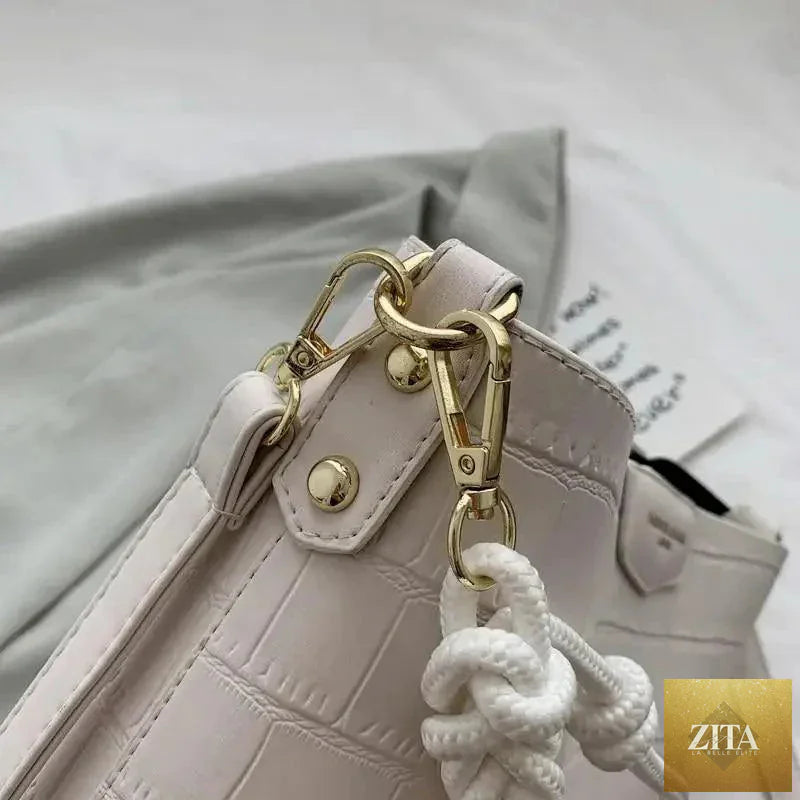 Elegant vintage-style women's bucket bag by Stevvex with genuine leather and stone pattern, shoulder strap, perfect for ladies.