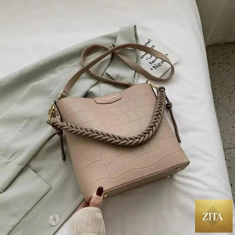 Elegant genuine leather women's bucket bag with stone pattern, stylish shoulder bag by Stevvex, vintage-inspired fashion accessory.