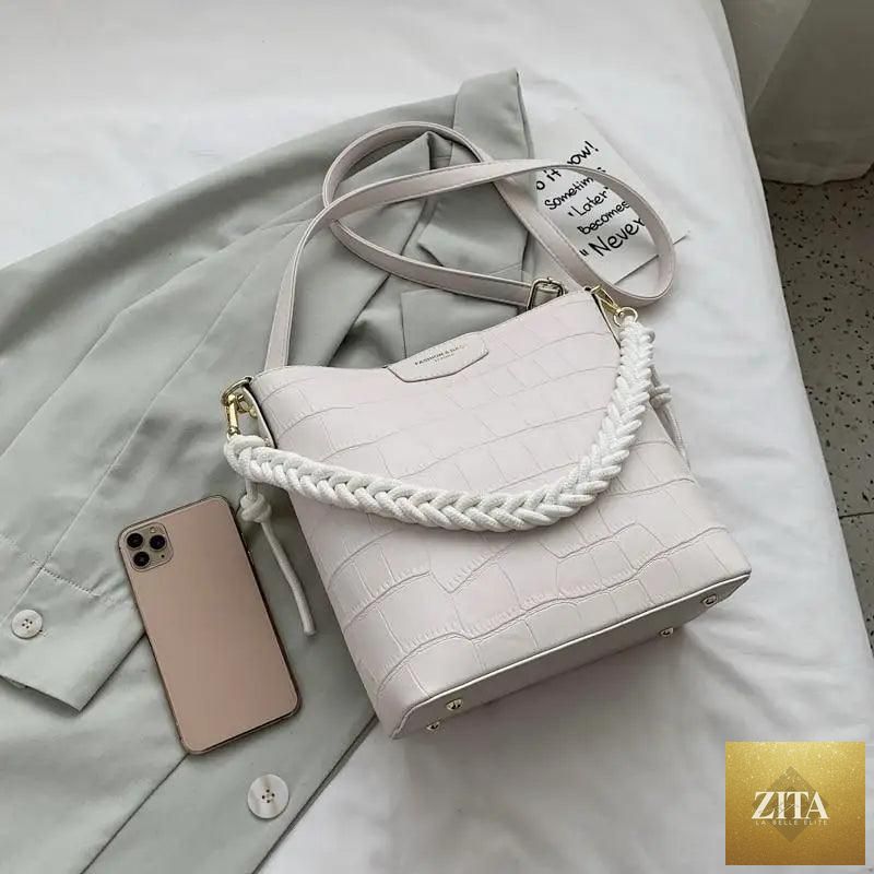Elegant genuine leather women's bucket bag with stone pattern, stylish shoulder bag by Stevvex, vintage-inspired fashion accessory.
