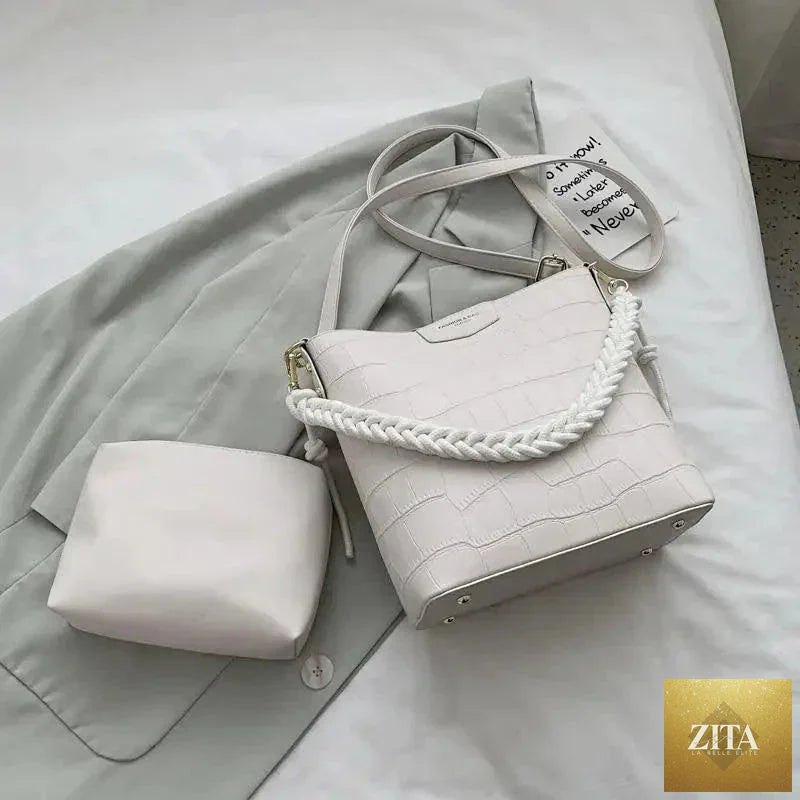 Elegant vintage women's bucket bag by Stevvex with genuine leather, featuring a stone pattern shoulder design for ladies.