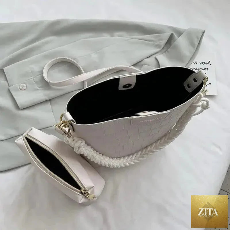 Elegant vintage-style women's bucket shoulder bag by Stevvex featuring genuine leather and a stone pattern design.