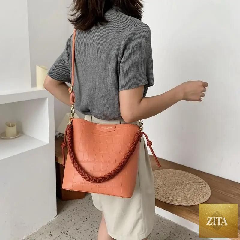 Elegant vintage-style women's bucket bag by Stevvex featuring genuine leather and a stone pattern shoulder design.