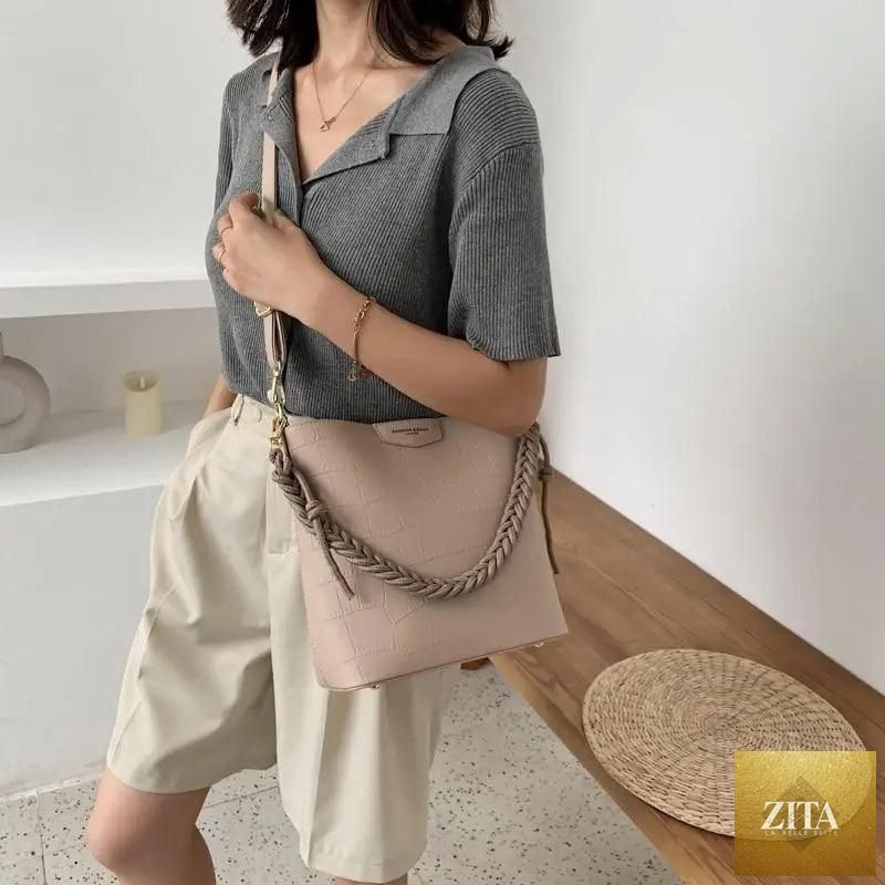 Elegant genuine leather women's bucket bag by Stevvex featuring a vintage stone pattern shoulder design for ladies.