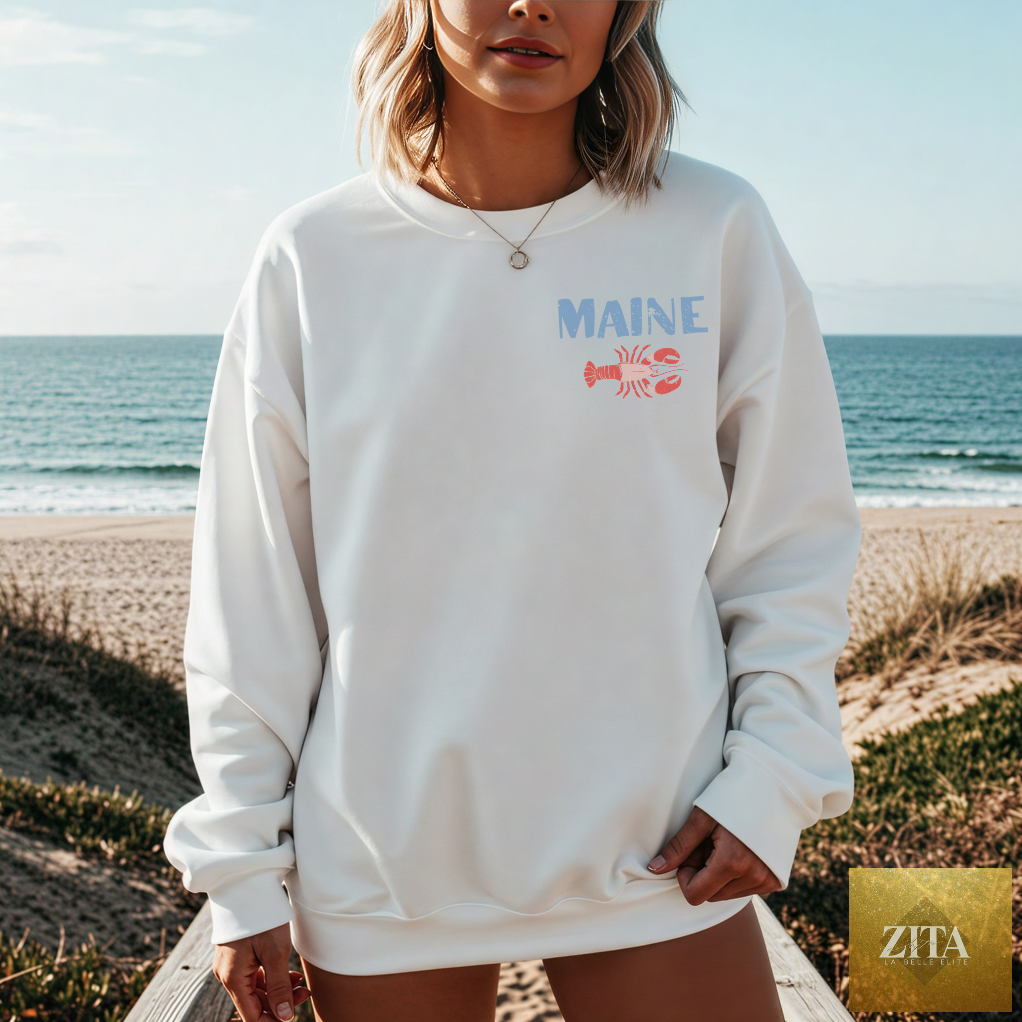 White Maine Lobster Seafood Club crewneck sweatshirt with a colorful lobster graphic on the front, by Hey Jude Graphic Tees.