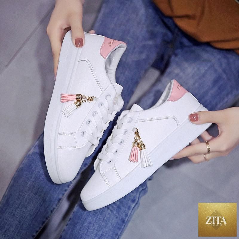White Stevvex women's breathable sneakers with low-top lace-up design, casual sports flats for comfortable walking and everyday wear.