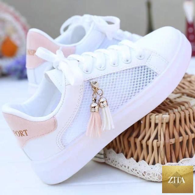 White Stevvex women's breathable sneakers with low-top design, lace-up closure, casual flat style, ideal for comfortable walking.