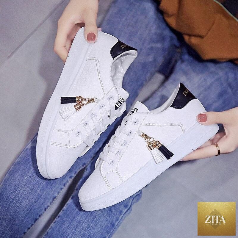 White women's breathable sneakers by Stevvex, casual low-top lace-up flats with soft, comfortable design for walking and everyday wear.