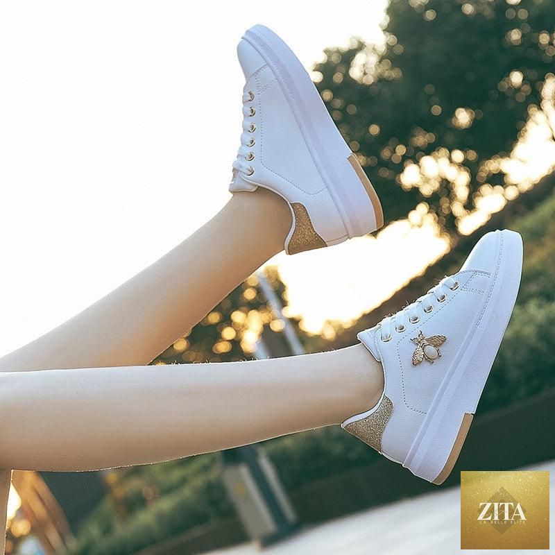 White Stevvex women's sneakers with platform, rhinestones, lace-up design, breathable fabric, and casual slip-on style.