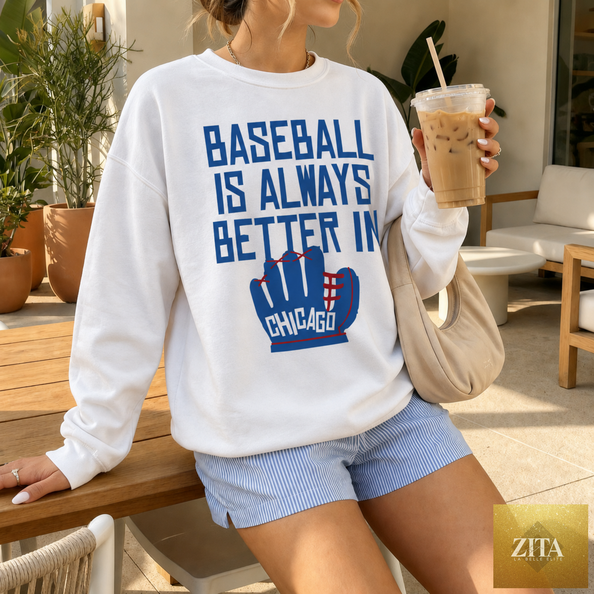 White baseball-themed T-shirt by Hey Jude Graphic Tees with Chicago skyline and "Baseball Is Always Better In Chicago" design.