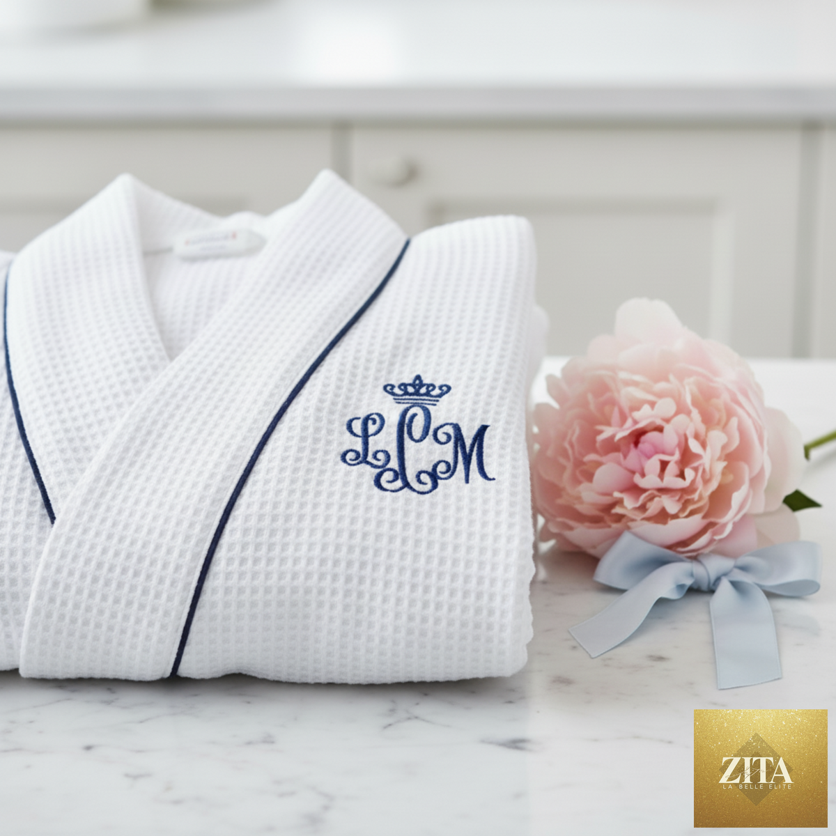 White knee-length waffle robe for women by Lotus Linen, featuring a soft, textured fabric and relaxed fit.