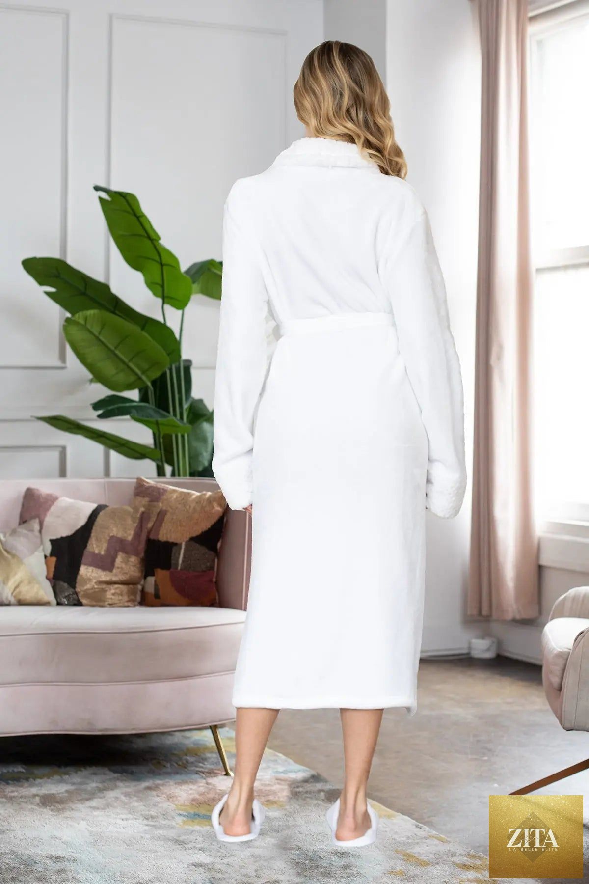 White women's ultra soft plush bathrobe by Lotus Linen, showing cozy, plush fabric and relaxed fit for comfort.