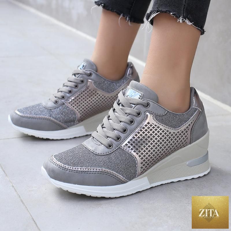 Women’s gold and silver Stevvex walking and jogging sneakers with height-increasing design, lightweight, casual, and comfortable for everyday wear.