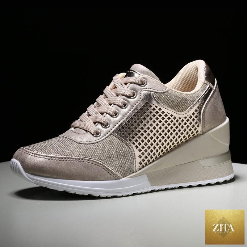 Women’s gold and silver Stevvex walking jogging sneakers with height boost, lightweight design, and comfortable casual athletic style.