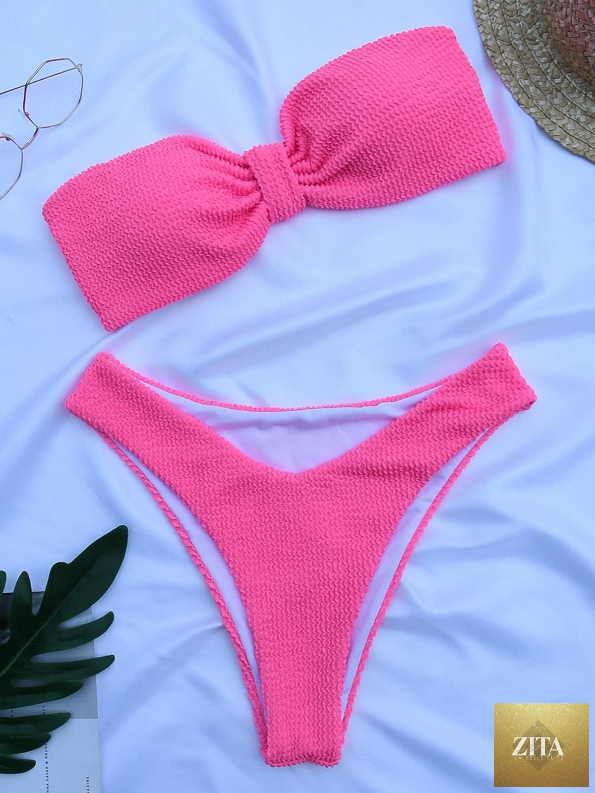 Women’s high-waist bikini swimsuit with metal ring accents, cross bandage design, cutout details, and tie-back closure by Stevvex.