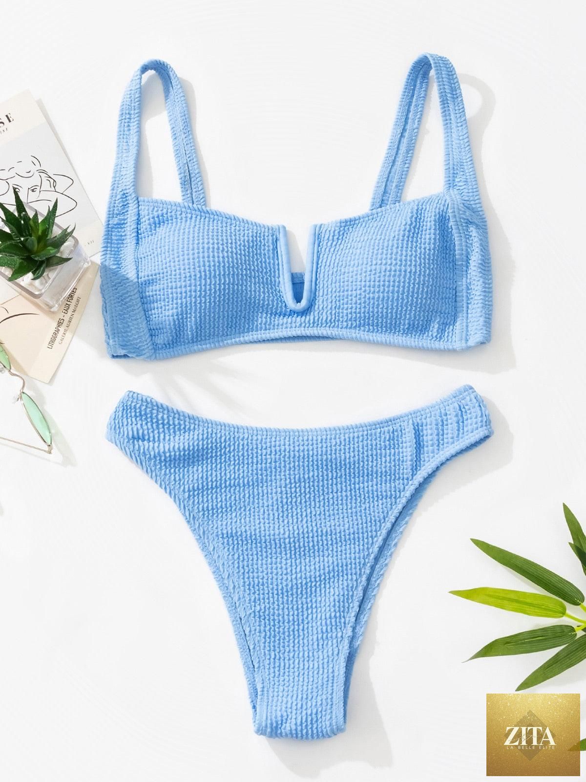 Women wearing Stevvex high-waist two-piece bikini with metal ring cross bandage design, cutout details, and tie-back style.