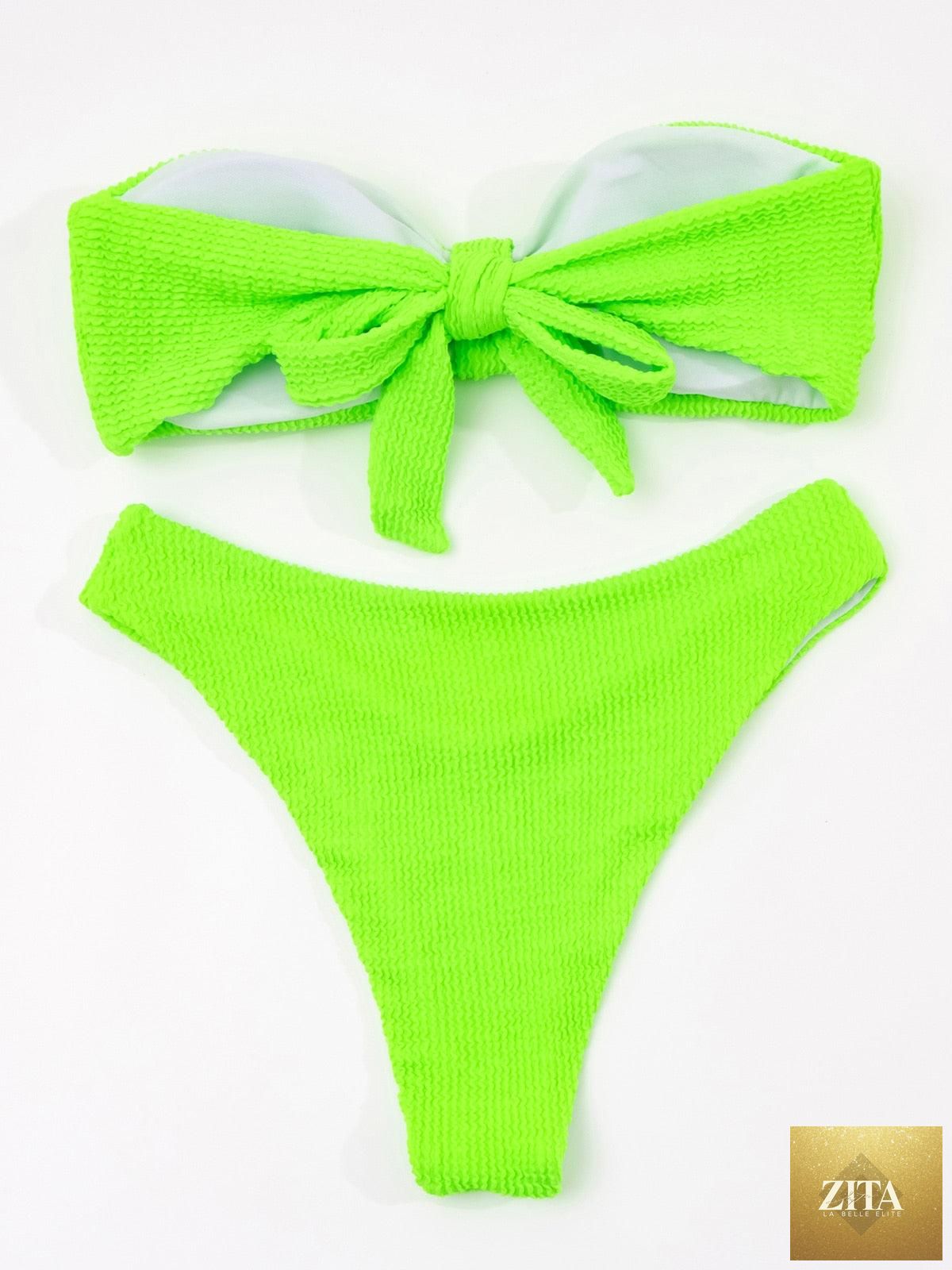 Women’s high-waist bikini swimwear with metal ring accents, cross-bandage design, and tie-back closure, style by Stevvex.
