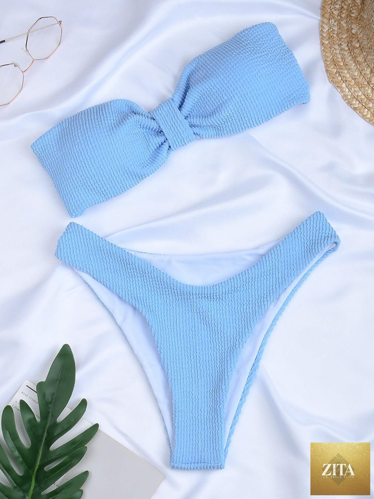 Women’s high-waist bikini swimwear by Stevvex featuring metal rings, cross bands, cutouts, and tie-back design in a two-piece swimsuit.