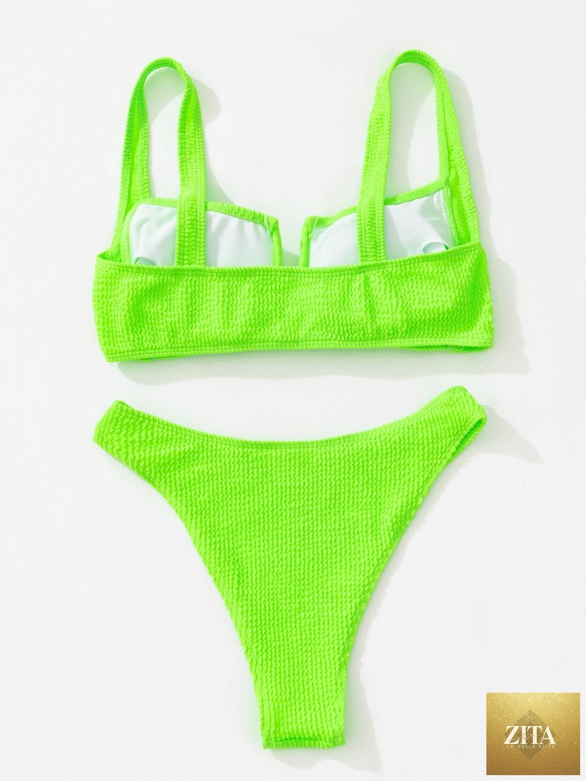 Women’s high-waist bikini swimsuit by Stevvex featuring metal ring accents, cross bandage design, cutouts, and tie-back style.