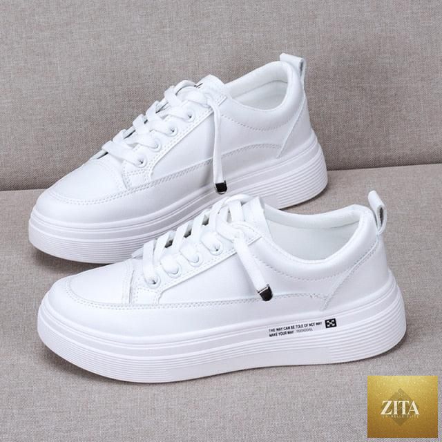 Women leather sneakers by Stevvex, white casual lace-up shoes with breathable vulcanized sole, modern flat walking sneakers.