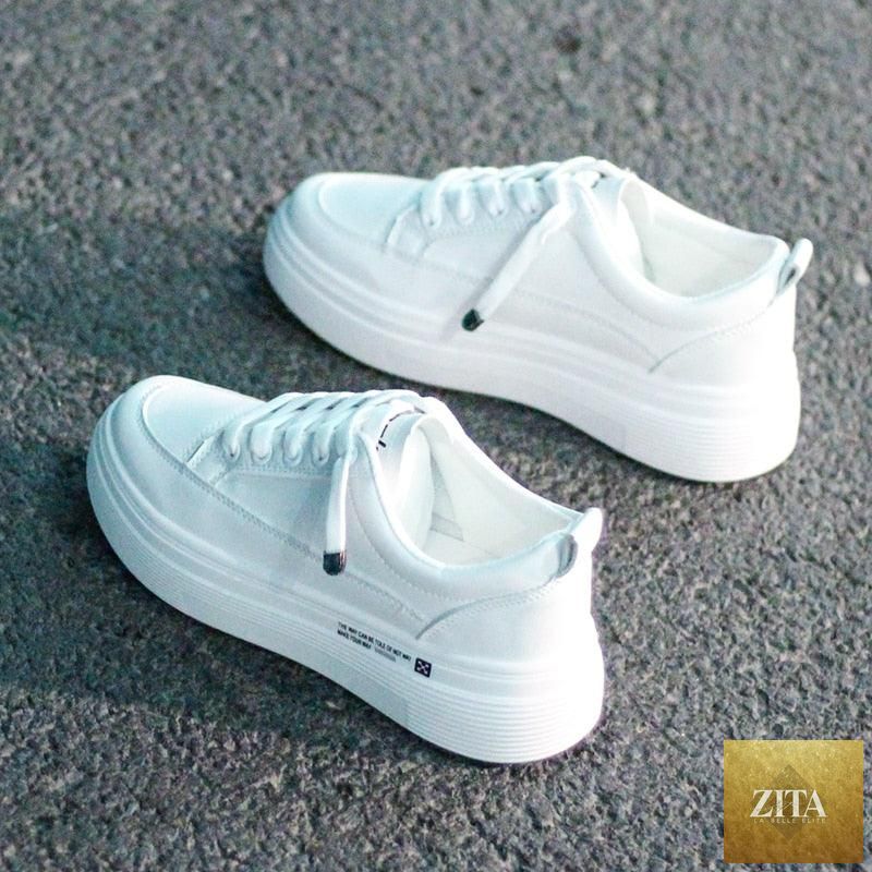 Women Stevvex leather sneakers, white casual lace-up shoes with breathable vulcanized design and modern flat style for walking.