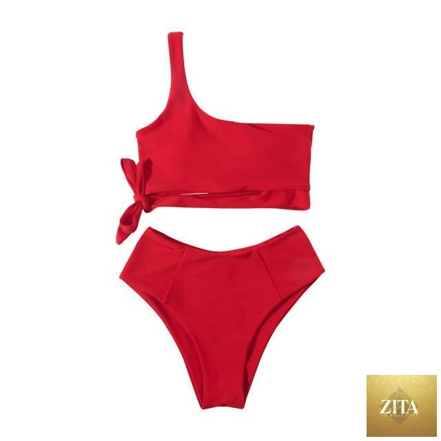 Women’s leopard print bikini featuring a one-shoulder top and high-waist bottoms, ideal for summer beachwear and poolside lounging.