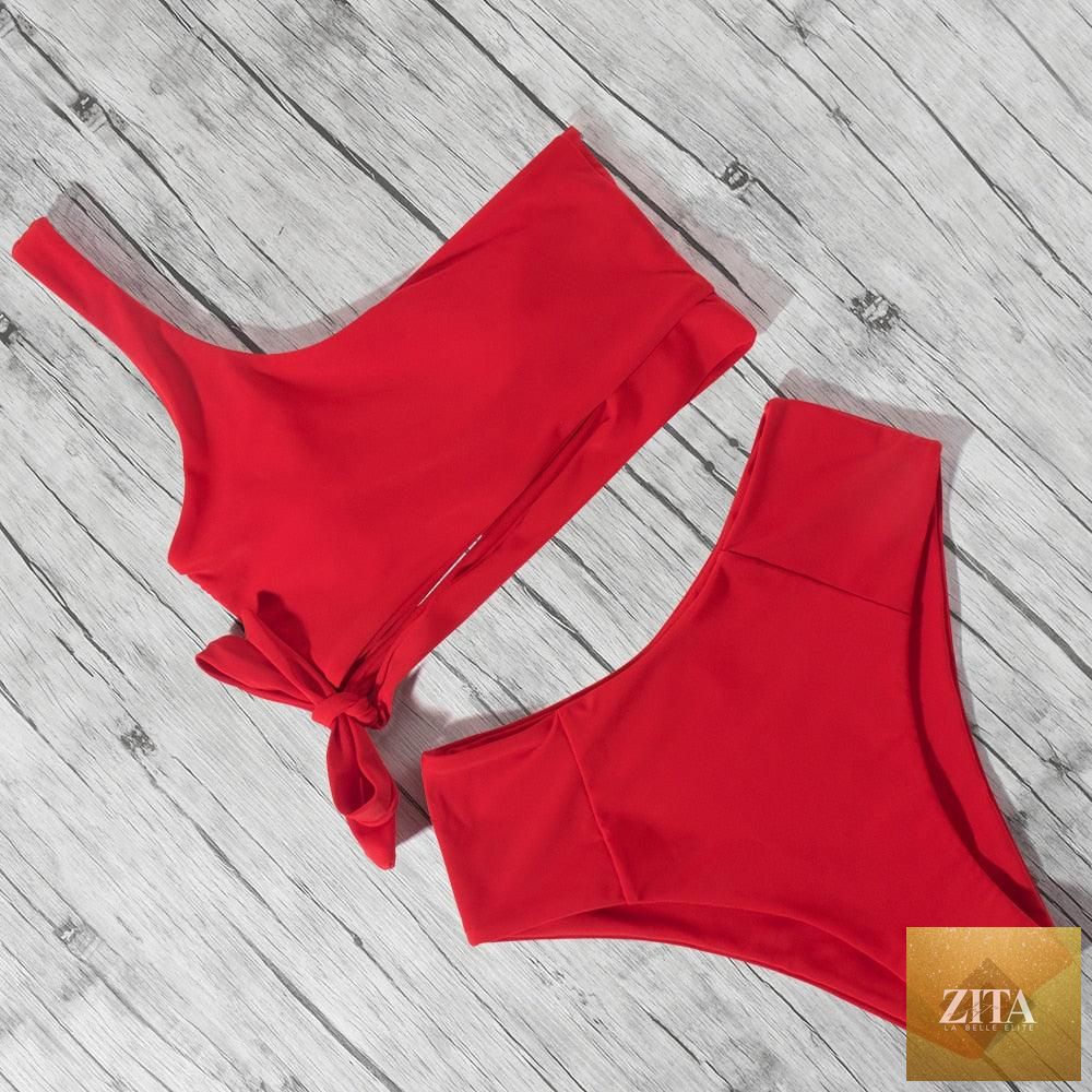 Women’s leopard print bikini set with one-shoulder top and high-waist bottoms, suitable for summer beachwear and swimming.