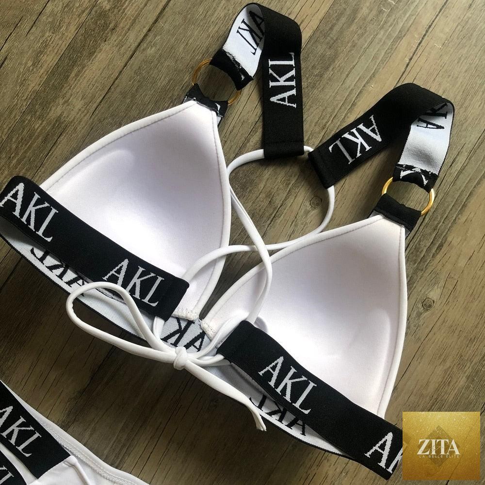 Women Stevvex luxury black and white push-up bikini with lace-up design, halter bandage style, letter print, perfect for summer swimming.