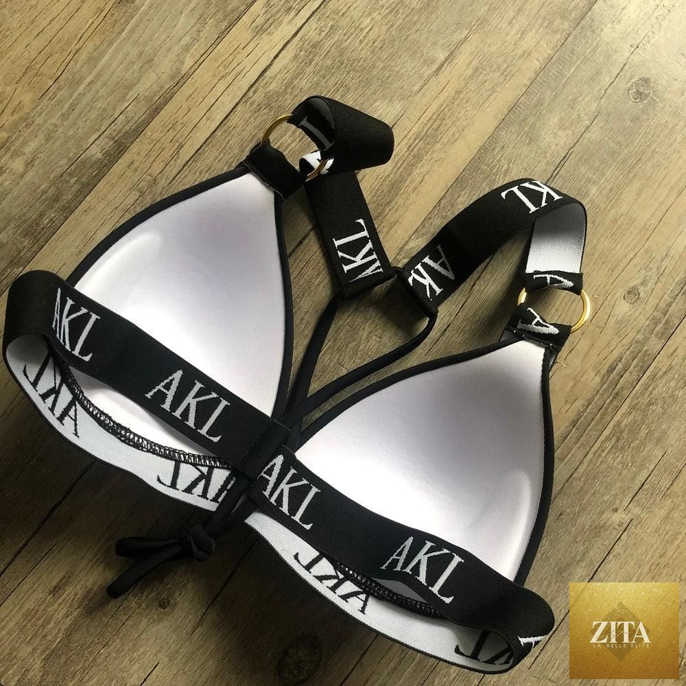Women Stevvex luxury black and white push-up bikini with lace-up design, halter bandage style, letter print, perfect for summer swimming.