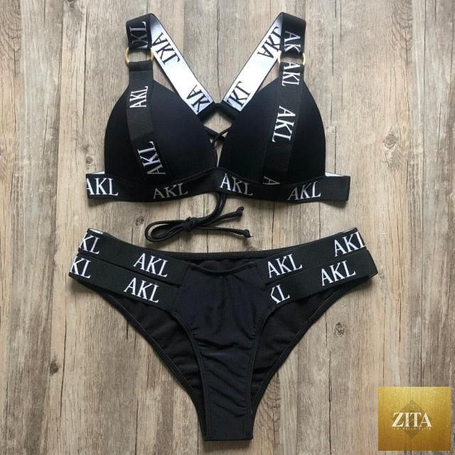 Women’s luxury black and white swimwear by Stevvex, push-up bikini with lace-up design, halter, letter print, and bandage style.