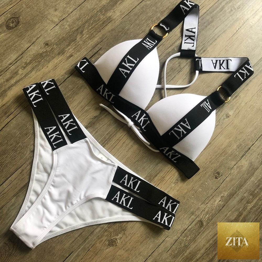 Women’s luxury black and white swimwear by Stevvex, push-up bikini with lace-up detail, halter bandage design, and letter print.