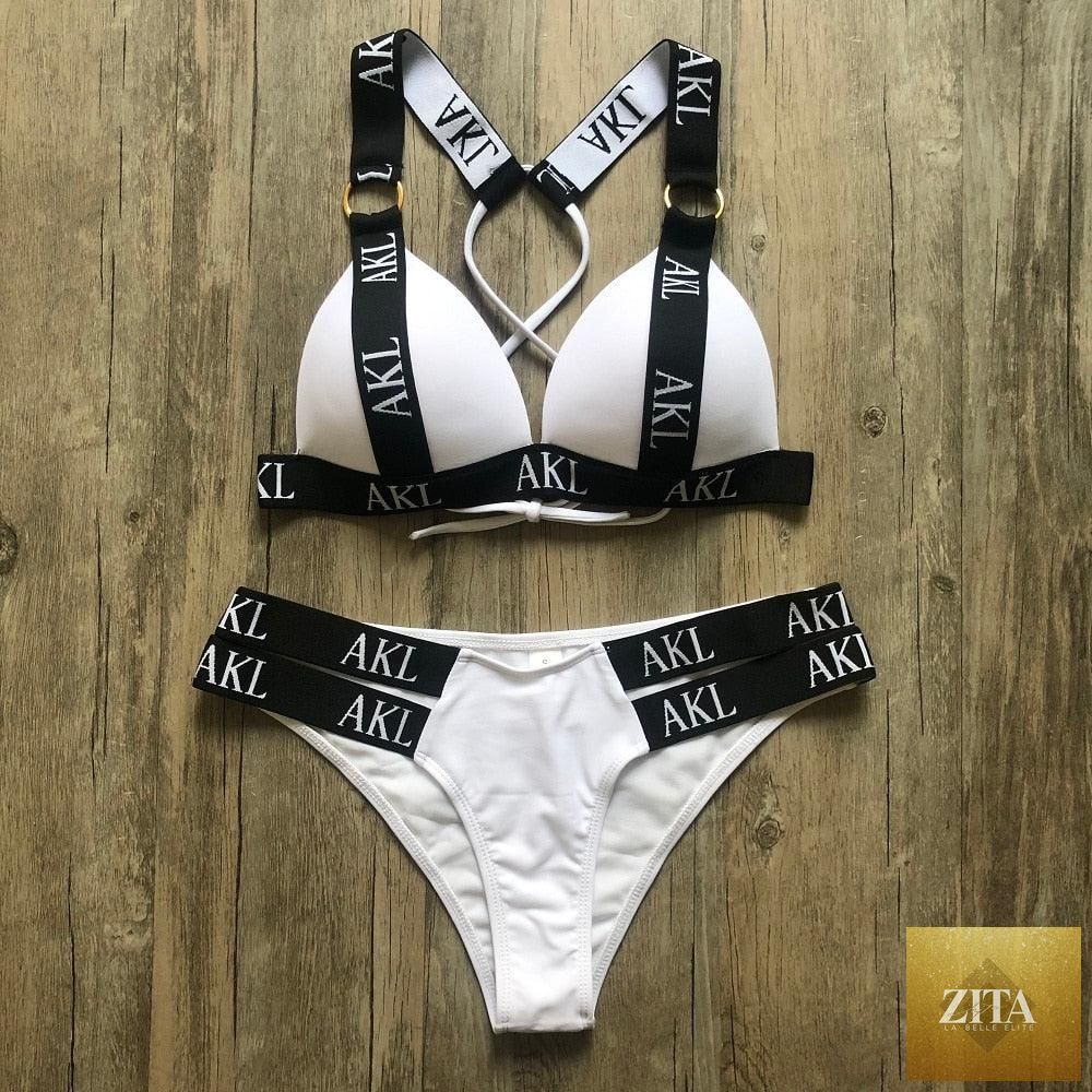 Women Stevvex luxury black and white push-up bikini with lace-up design, letter print, halter style, and bandage fit for summer swimming.