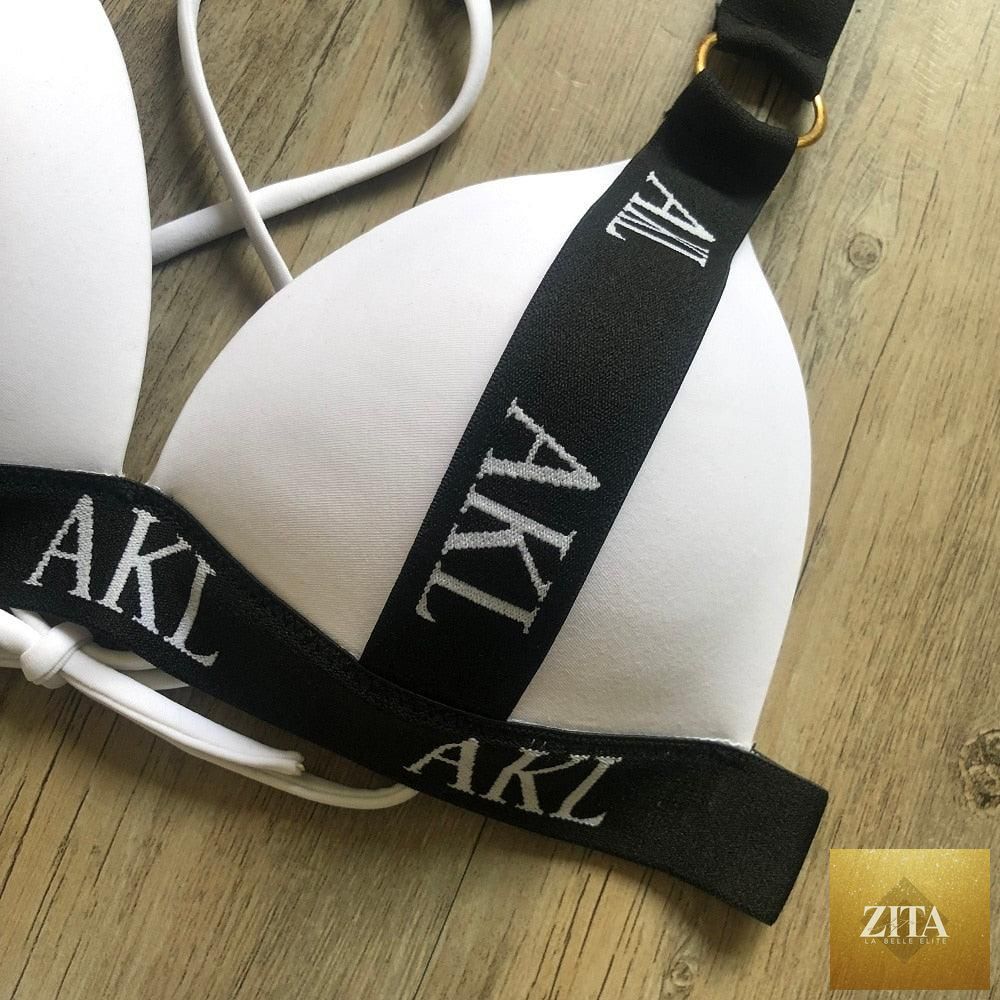 Women Stevvex luxury black and white swimwear with push-up bikini, lace-up design, halter bandage style, and letter print for summer.