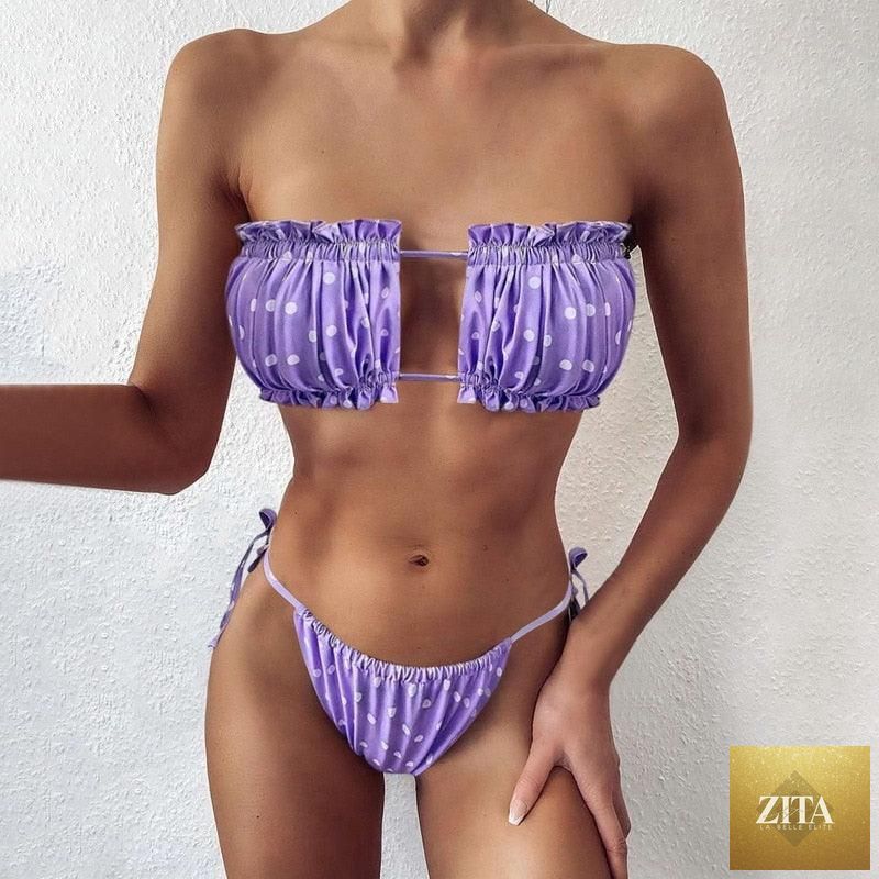 Women wearing a luxury leopard print high waist bikini with push-up bra, tie sides, cutout design, and high-cut padded swimwear.