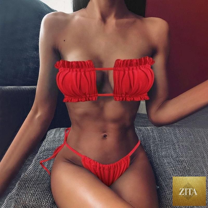 Women wearing luxury leopard high waist bikini with tie sides, push-up bra, cutout design, and high-cut padded swimwear by Stevvex.