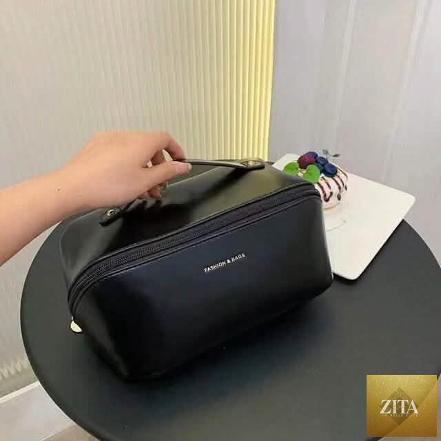 Black leather women’s makeup organizer toiletry bag with multiple compartments for travel and personal care essentials.