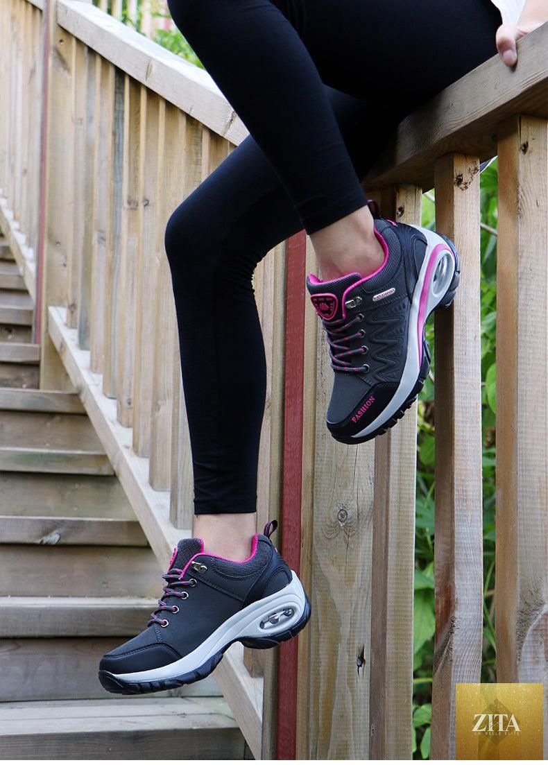 Women wearing Stevvex running air cushion athletic sneakers with breathable mesh, lace-up design, high platform, suitable for walking and gym.