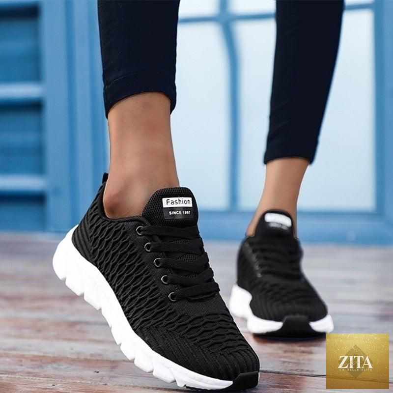 Women Stevvex running sneakers with breathable mesh, lightweight flat shoes, casual lace-up design, outdoor sports footwear.