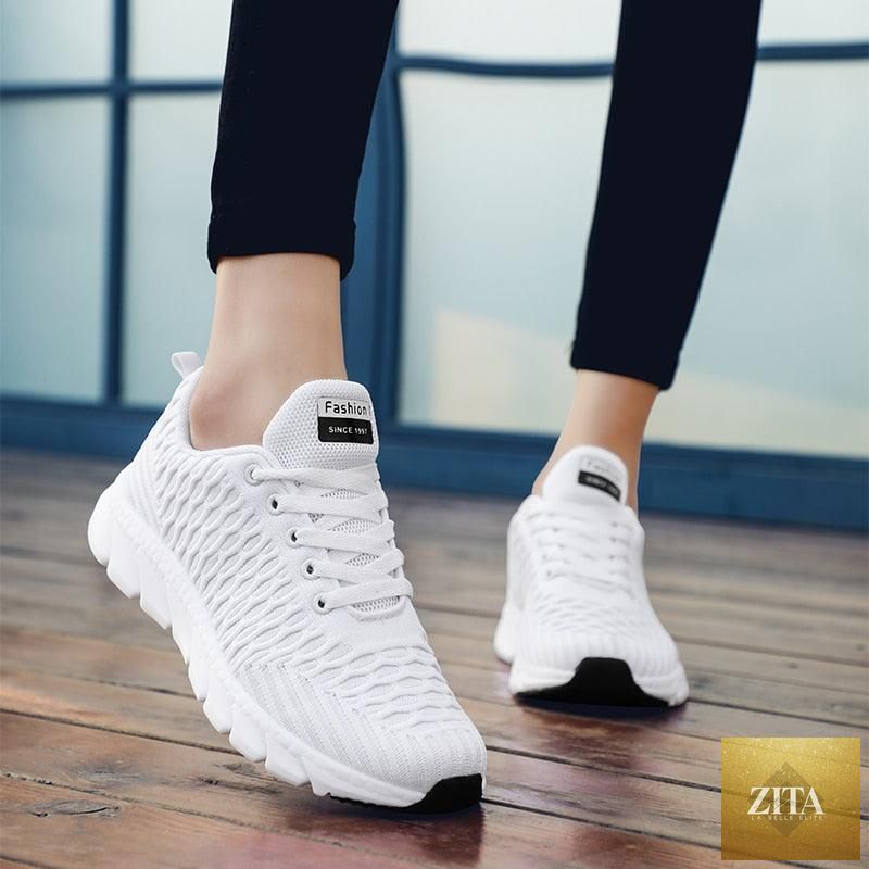 Women Stevvex running sneakers with breathable mesh, lightweight flat shoes, casual lace-up design, outdoor sports footwear.