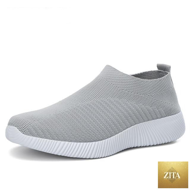 Women Stevvex running sneakers with breathable mesh, lightweight flat shoes, lace-up design, ideal for casual outdoor activities.