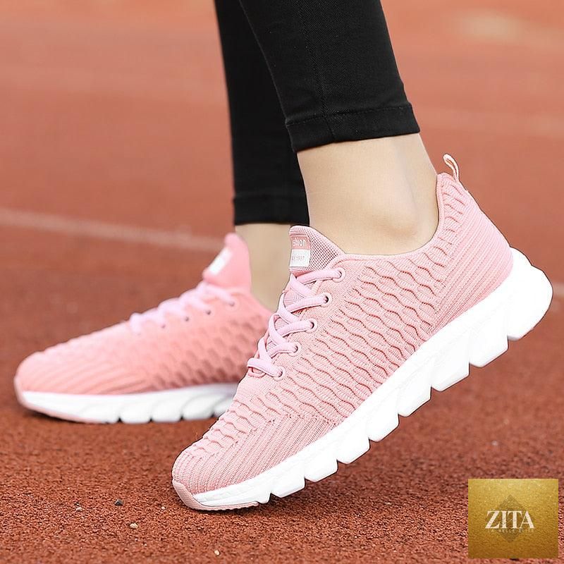 Women Stevvex running sneakers with breathable mesh, lightweight flat shoes, lace-up design, ideal for outdoor casual and sports use.