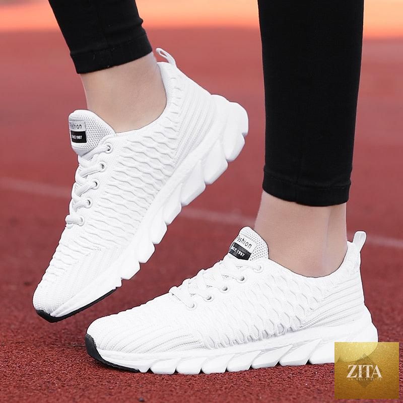 Women Stevvex breathable running sneakers with mesh upper, lightweight flat shoes, lace-up design, ideal for outdoor casual and sports wear.