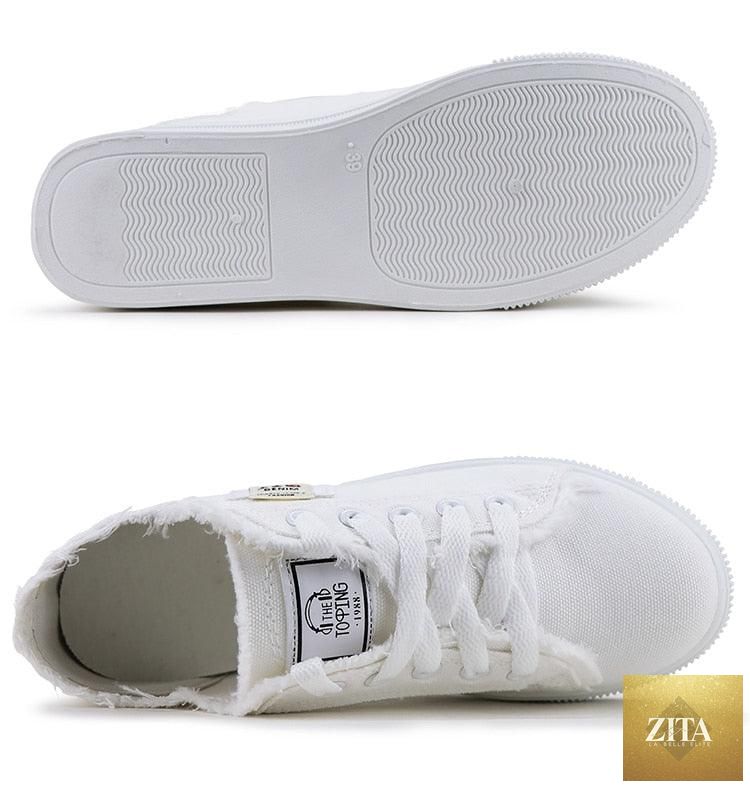 Women's breathable canvas summer sneakers by Stevvex, low-top white lace-up shoes for casual outdoor wear.