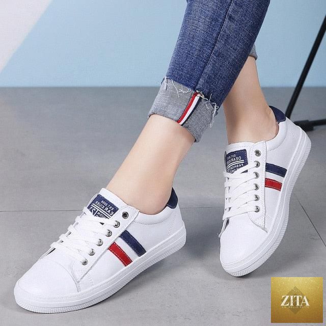 Women's white genuine leather sneakers by Stevvex, casual and fashionable flat tennis shoes with vulcanized sole and comfortable fit.