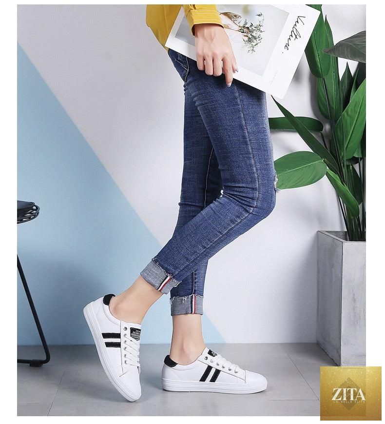 Women's genuine leather sneakers by Stevvex featuring white casual and tennis shoes with flat, vulcanized sole and stylish design.