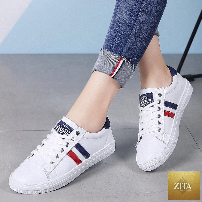 Women’s Genuine Leather Sneakers by Stevvex, casual white flat tennis shoes with vulcanized sole, stylish and comfortable for everyday wear.