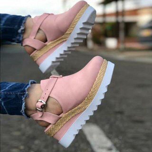 Women's vintage Stevvex platform sandals with buckle straps, straw design, thick soles, and retro flatform style.