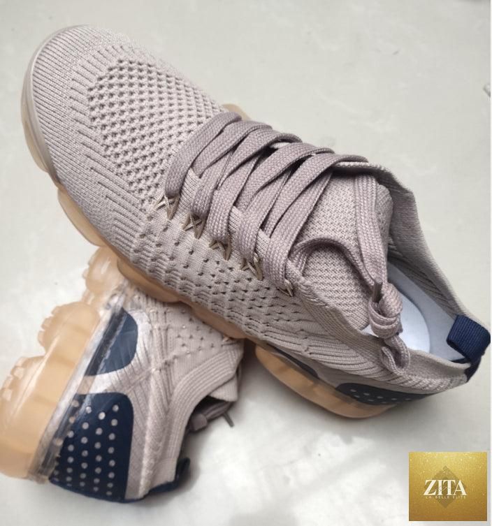 Women’s stylish Stevvex sneakers with air cushion sole, lightweight mesh design, suitable for running, walking, and athletic activities.