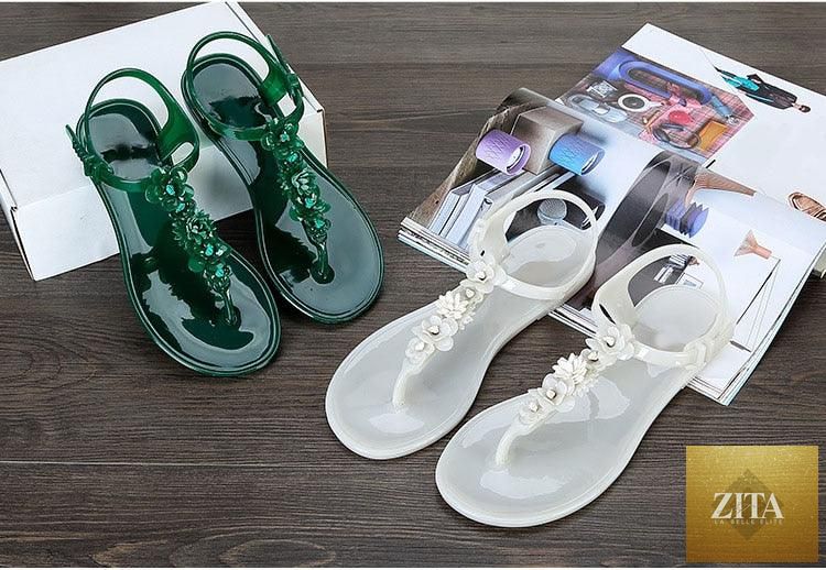 Stevvex women's summer flip flops with T-strap design, floral pattern, breathable, non-slip flat slides for casual beach and dress wear.